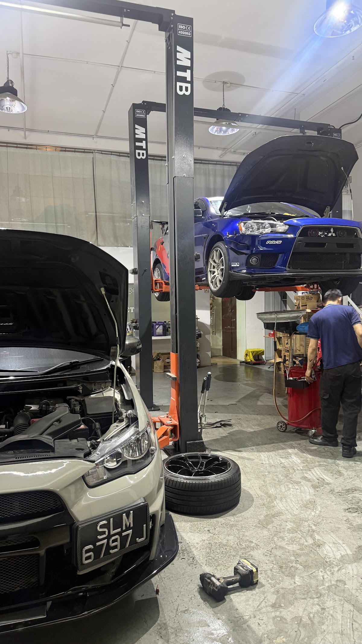Two Lancer Evos in for work, one on the lift
