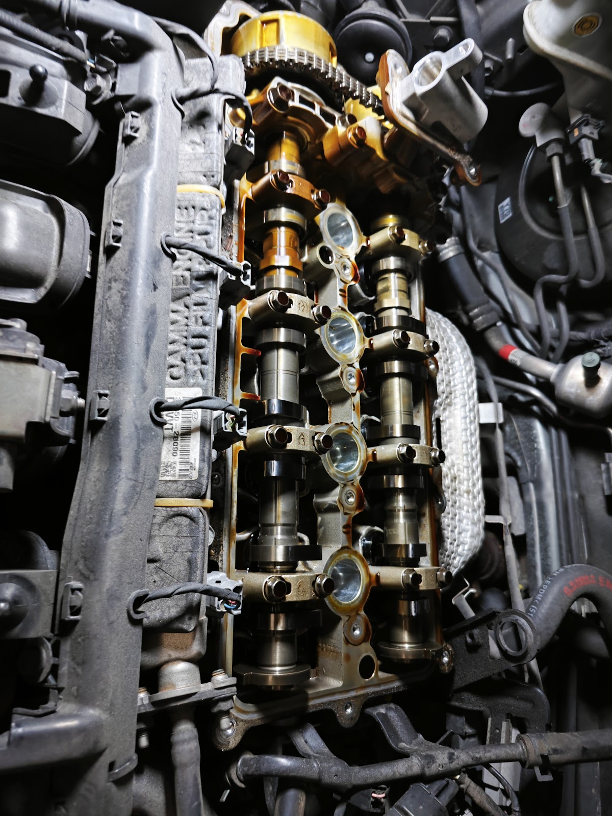 Engine opened up at the workshop: camshafts and timing chain exposed