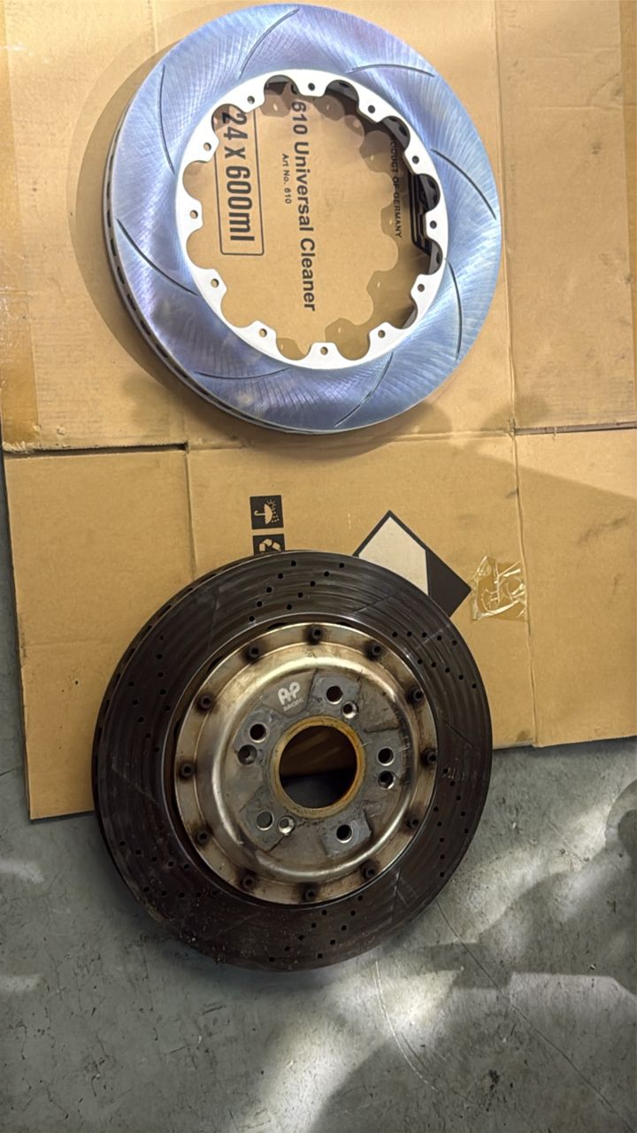 Worn rotor out, new slotted disc ready